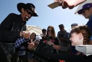 Richard Petty signs autographs for fans in the Fan Zone before the start of the Toyota/Save Mart 350 NASCAR Cup Series race on July 9, 2024, - Source: Getty
